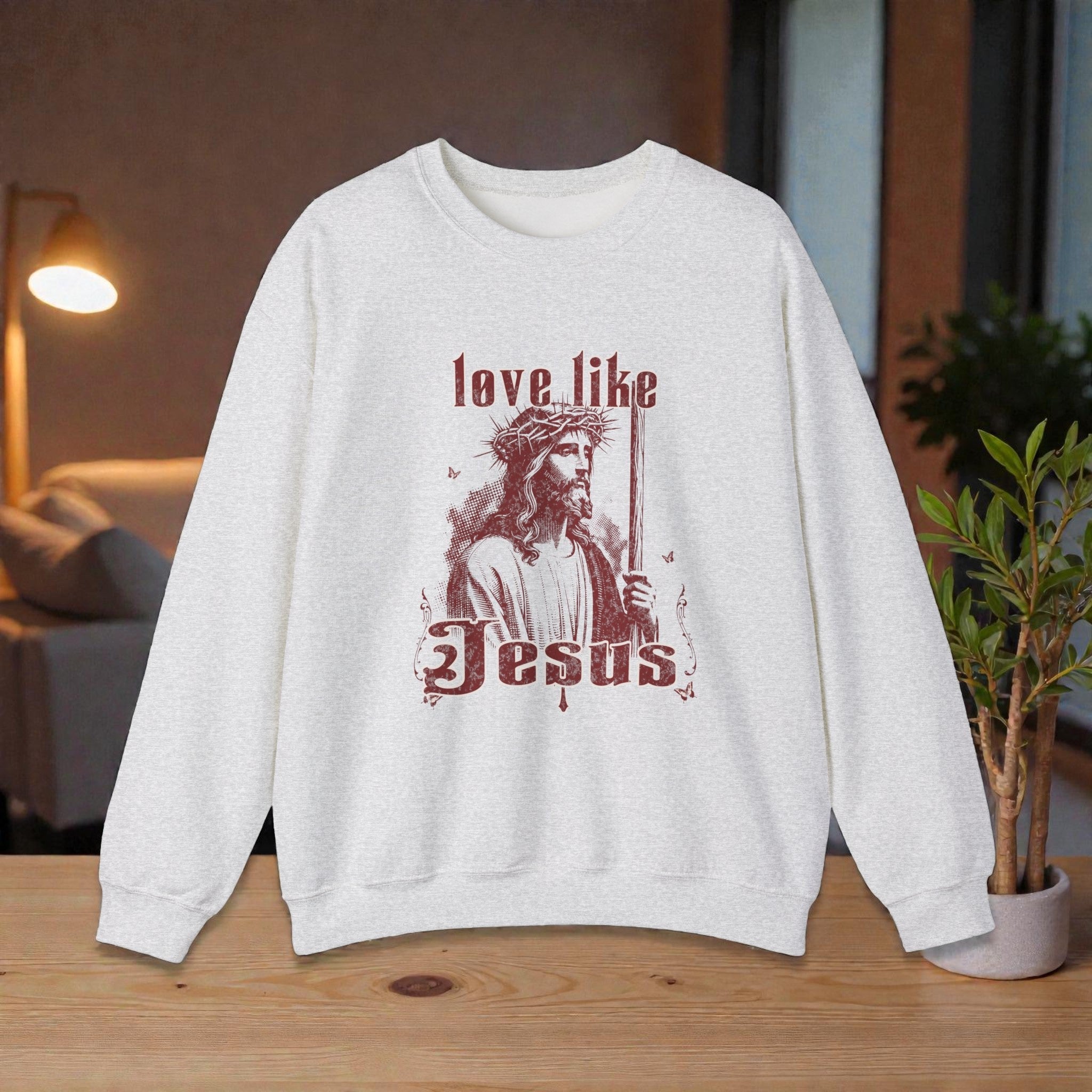 love like Jesus sweatshirt featuring rustic red artwork of Jesus on cozy fleece